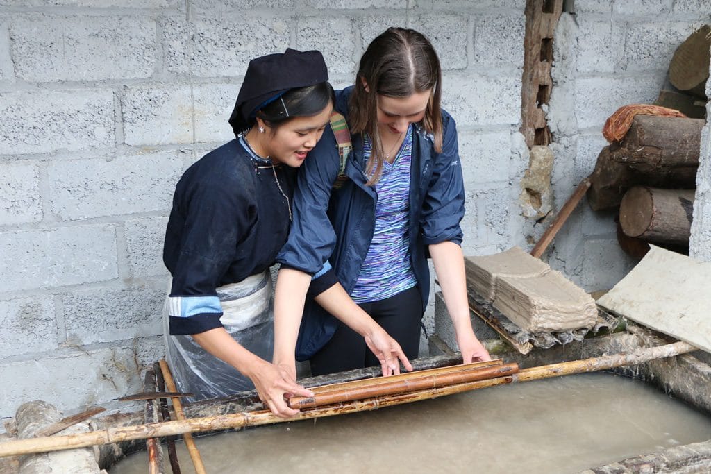 making paper with local people in Cao Bang Wonderlands Tour
