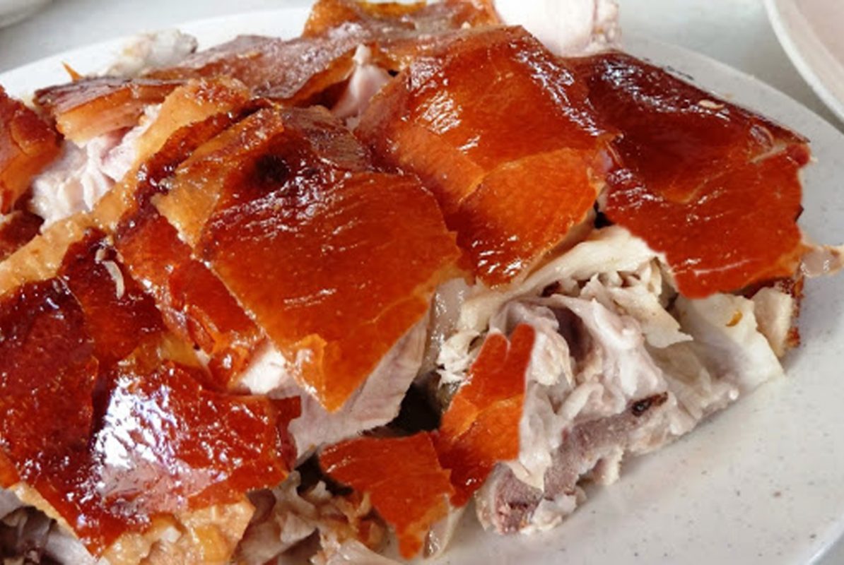 Roast pork infused with the fragrant mac mat leaf